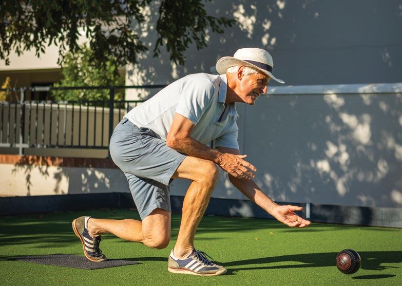 A resident playing bowls